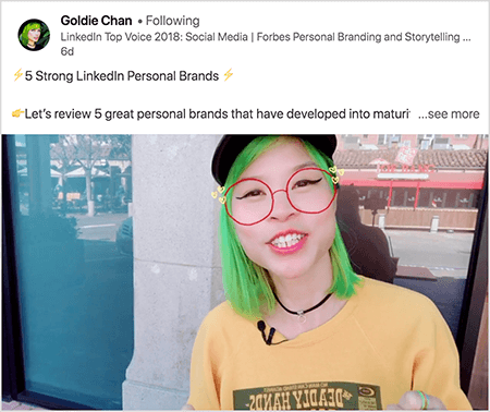 Detta är en skärmdump av Goldie Chan som delar en video med en tydlig takeaway. Texten ovanför videon säger “5 starka personliga varumärken på LinkedIn.. se mer". I videobilden dyker Goldie upp från bröstet. Hon är en asiatisk kvinna med grönt hår. Hon har smink, ett svart chokerhalsband och en gul skjorta. Ett videofilter gör att det ser ut som att hon har röda glasögon skissade med en markör.